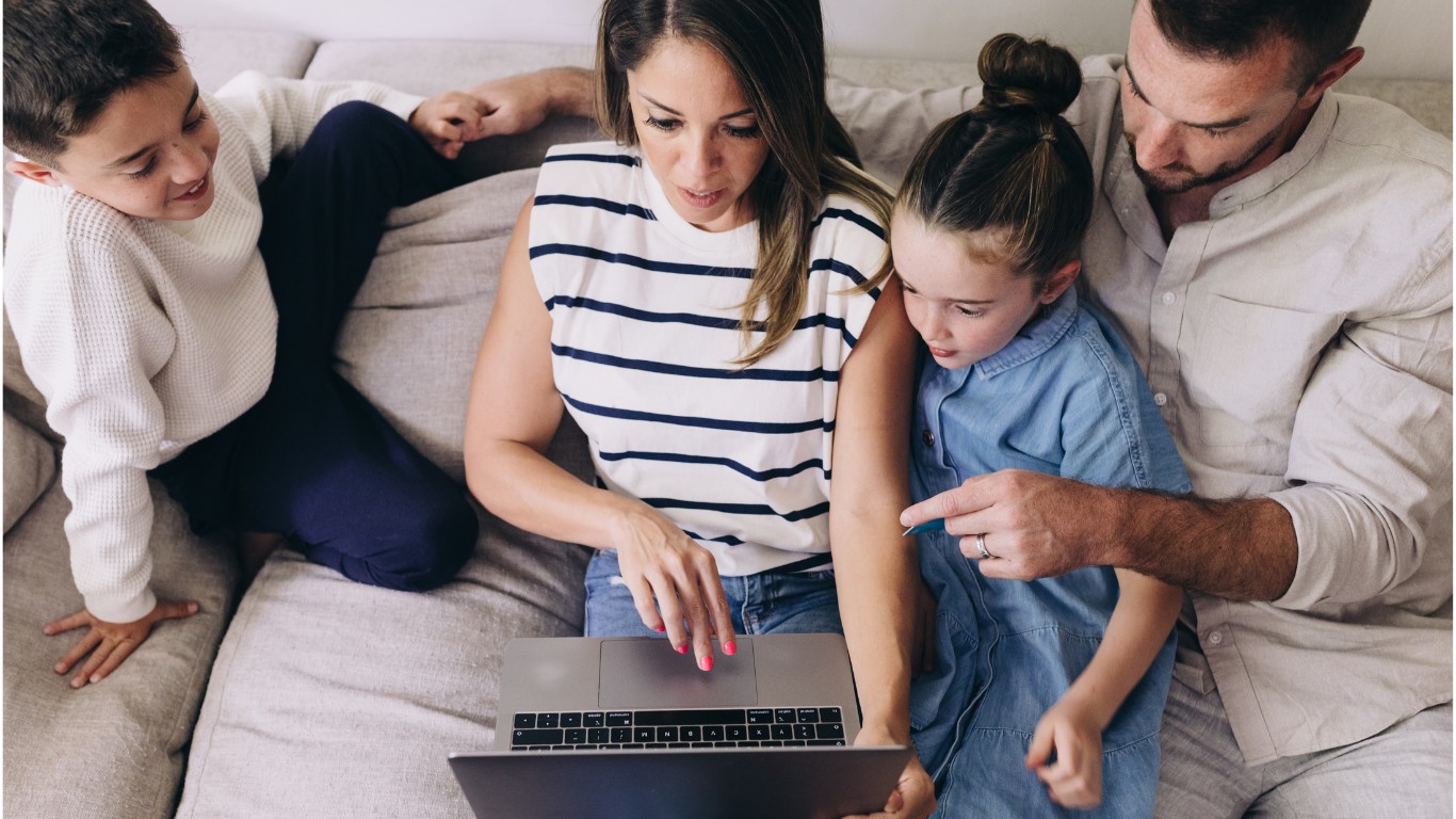 Family looking at savings together on a laptop